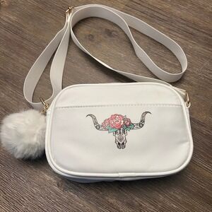 Like Dreams White Crossbody Bag with Bull Skull Floral Design and Pom Pom NWT